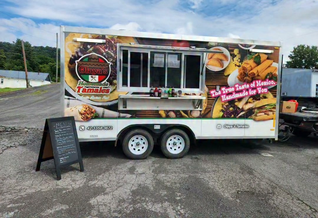 The Olaya's Tamales truck parked and set up on location, ready to serve.